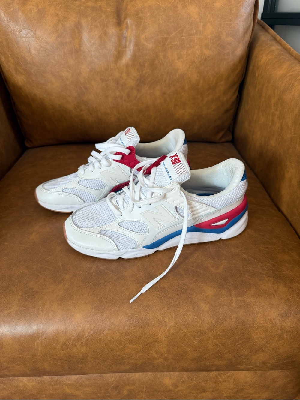 Men’s New Balance White Sneakers with Red & Blue Highlights